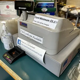 a cash register and a bottle of water