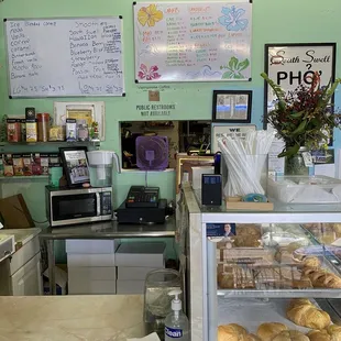 a bakery counter with a variety of pastries