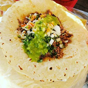 Burrito al pastor , with pico de gallo, guacamole, rice beans,  and red sauce