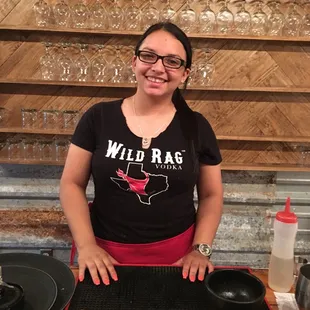 a woman preparing a drink