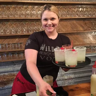 a woman serving drinks