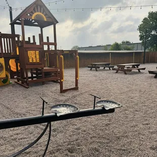 Outdoor seating and children&apos;s play area.