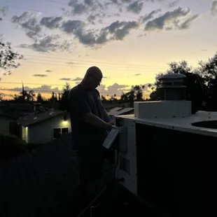 Enjoying the sunset with a rooftop view.