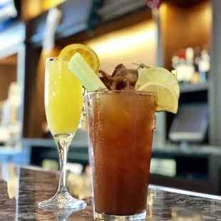 two cocktails on a bar