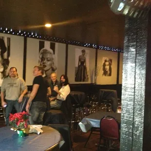 a group of people standing around a table