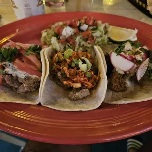 Left to right: Carnitas, pork belly, and carne tacos