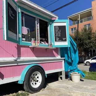 a pink and blue food truck