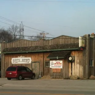 a car parked in front of the restaurant