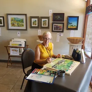 One of our members painting at the gallery.