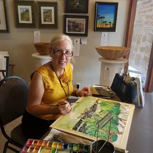 One of our members painting at the gallery.
