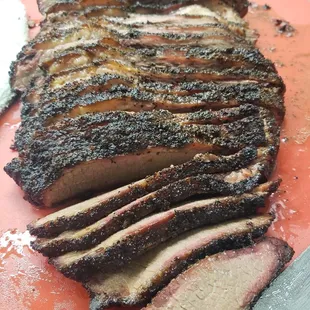 sliced brisked meat on a cutting board