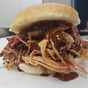 a pulled pork sandwich with barbecue sauce