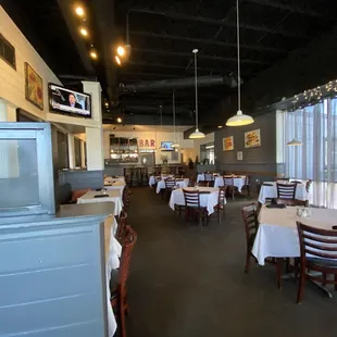 a dining room with tables and chairs