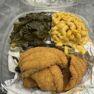 Catfish dinner with collard greens and Mac and cheese
