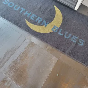 a person standing in front of a doormat