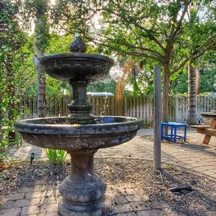 an outdoor patio with a fountain