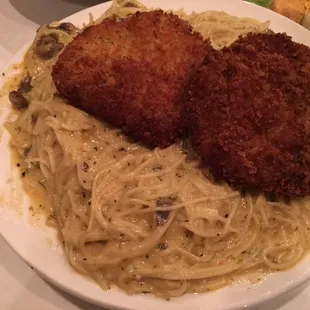 Crab Cake Pasta - Golden fried crab cake served over angel hair pasta with étouffée sauce