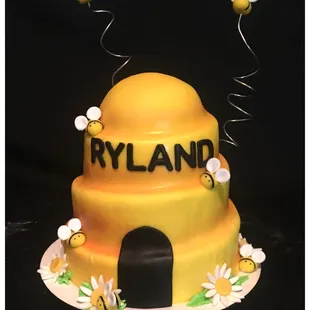 a cake with a beehive on top