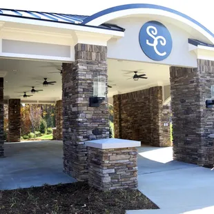 Outdoor pavilion with ceiling fans and fireplace for anytime of the year