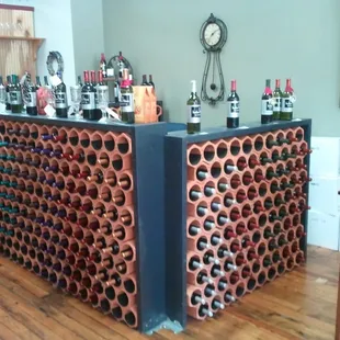 a wine rack with wine bottles
