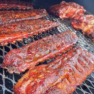 ribs cooking on a grill