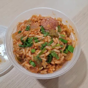 a bowl of rice and meat