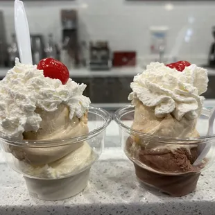 Two scoops each of frozen custard, with complimentary whipped cream and cherry.