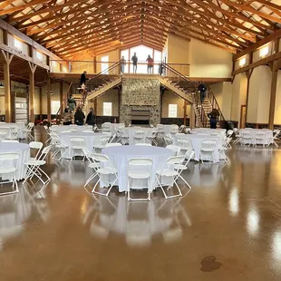 a banquet hall with tables and chairs
