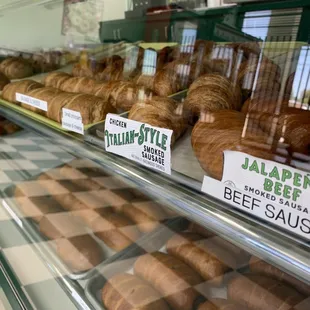 a variety of pastries in a display case