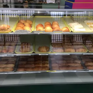 a display case filled with donuts