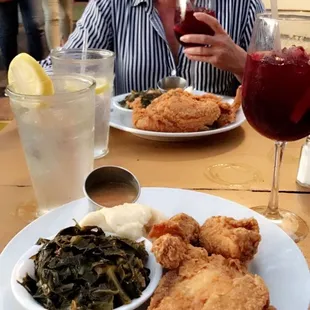 Fried chicken, greens, mashed potatoes, and sangria.