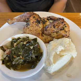 Signature Smoked Chicken Wings with collared greens and mashed potatoes