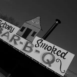 a sign for a smokey barbq