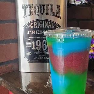 a colorful drink and a flask