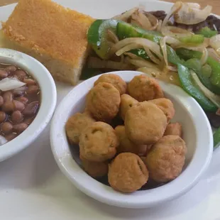 8oz hamburger steak with fried okra, pintos, and cornbread