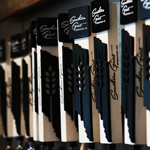 a row of beer taps