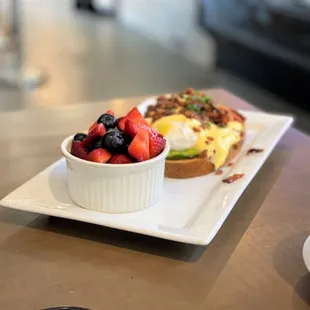 EGGS BENEDICT $11.50 Two Poached Eggs, Sourdough Bread, Bacon, Avocado and  SoGro Hollandaise.