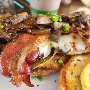 Grilled chicken sandwich with sauteed onions and mushrooms with bacon. Highly recommend!