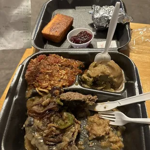 Chop steak, spaghetti, dressing, cranberry sauce, and cornbread.