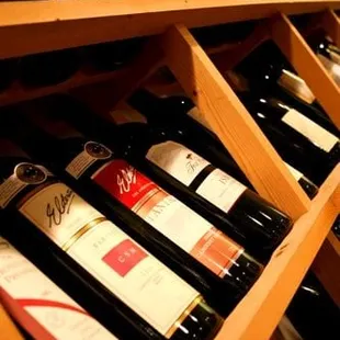 a wine rack full of wine bottles