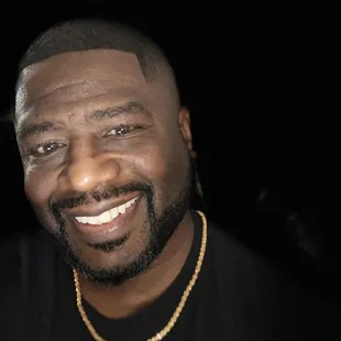 a close up of a man smiling
