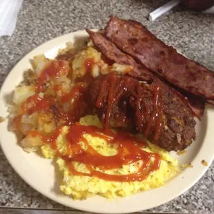 Fried salmon cakes, cheese eggs, turkey bacon, plain homefries