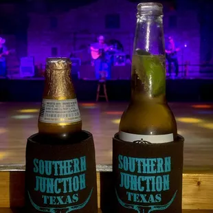 two beer bottles on a table