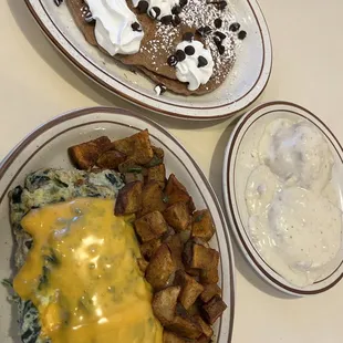 Kid&apos;s Happy Face Chocolate Pancakes. Spinach/Mushrooms Omelette w/ potatoes and biscuits and gravy.