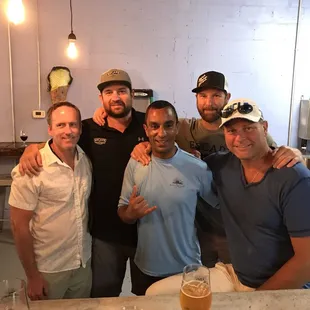 a group of men posing for a picture