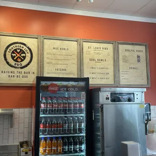 This is the menu and soda fridge
