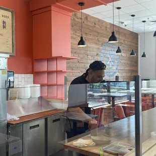Picture of owner at work making our sandwiches