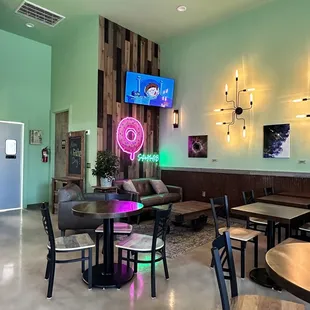 a restaurant with a neon sign