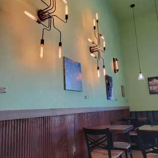 Interesting lighting fixtures in a nice and comfortable seating area.