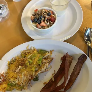Cup of baked oatmeal with fruits &amp; cuts, bacon and loaded hashbrowns.